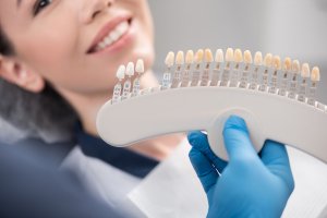 Woman smiling with shading tooth chart